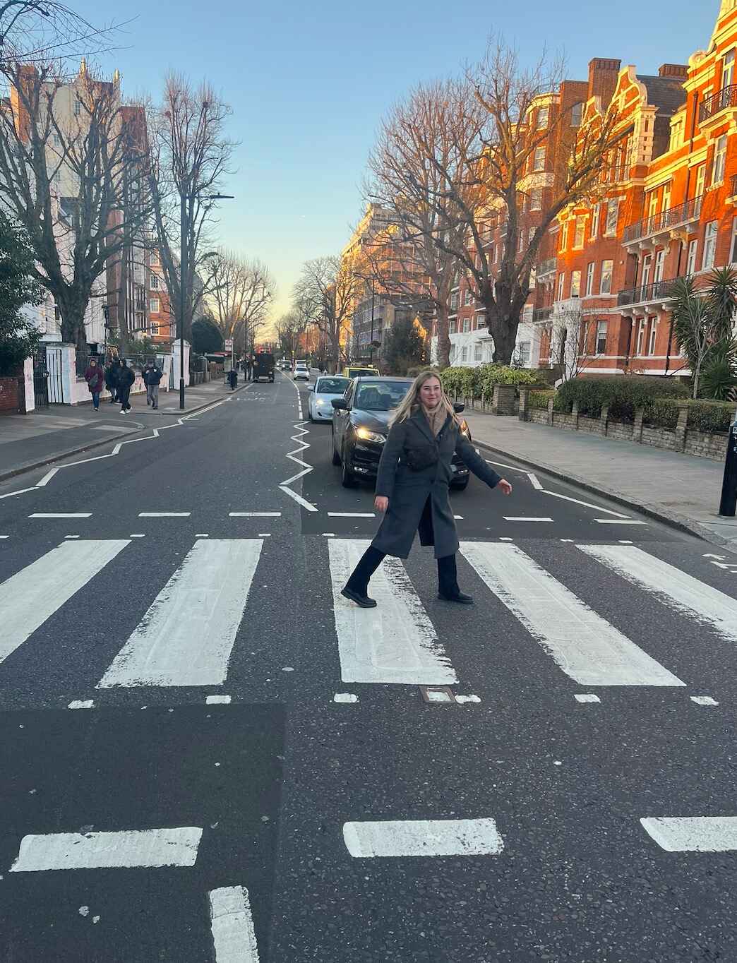 Person walking across Abbey Road.